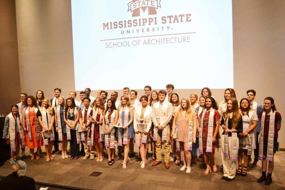 School of Architecture Class of 2024 poses on stage